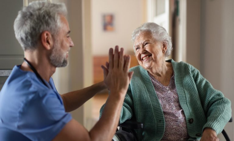 Caregiver,Spending,Time,With,His,Senior,Woman,Client,At,Her