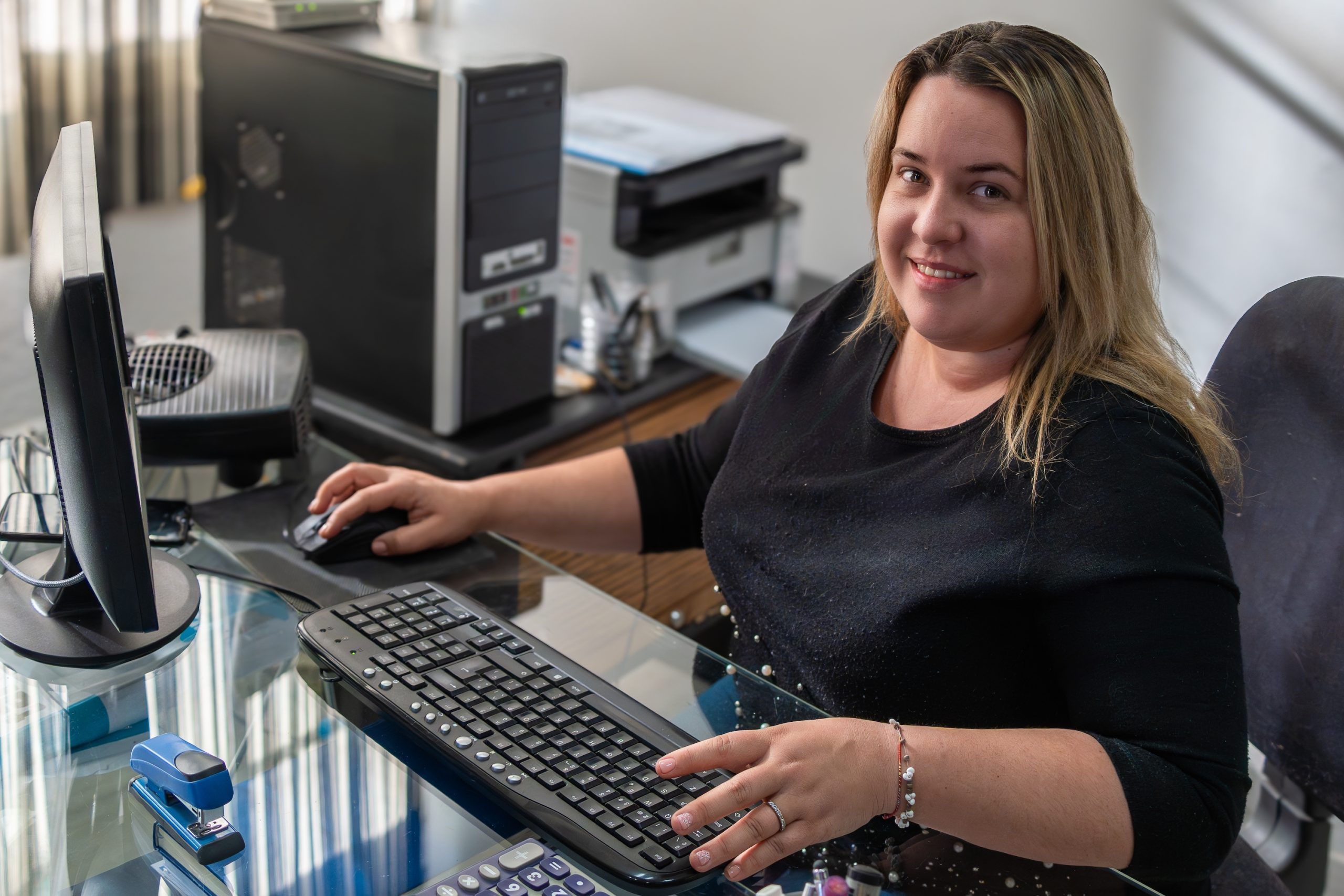 A,Confident,Woman,Is,Captured,Working,With,A,Computer,,Her
